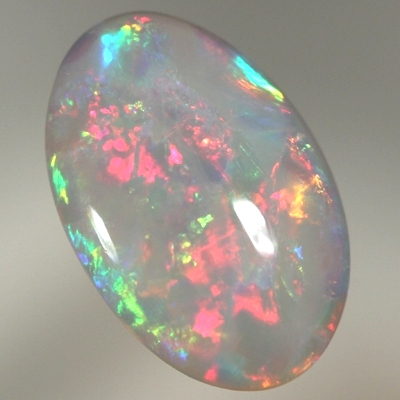 SOLID SEMI BLACK OPAL Bright crisp rolling flashes. Fire red, neon yellow, green and blue